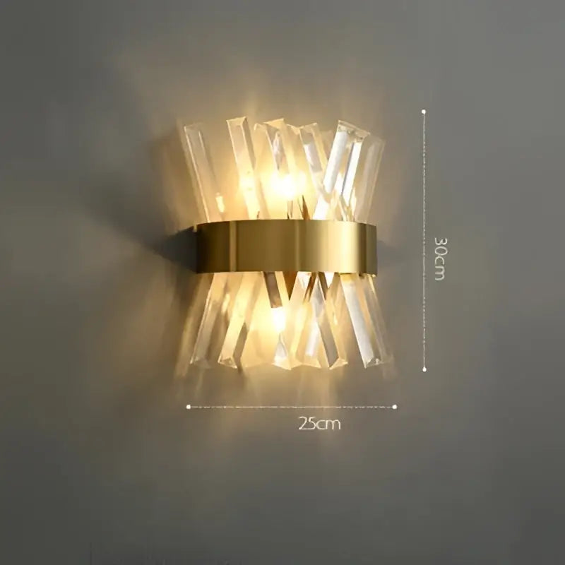 Gold-toned art deco stainless wall sconce with clear crystal prisms in radial pattern for bedroom decorbites decor