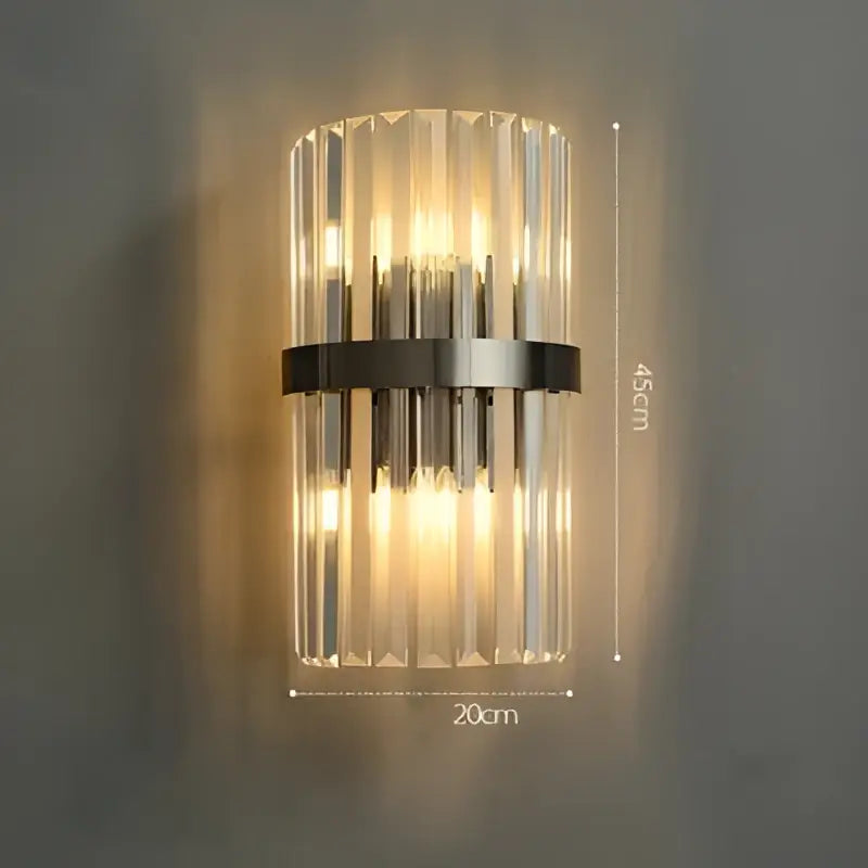 Clear crystal glass wall sconce with sleek black metal band featuring art deco stainless design by decorbites