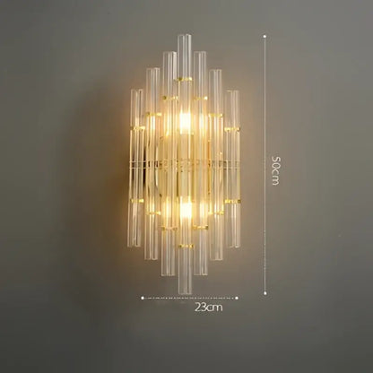 Gold-toned decorbites art deco stainless wall sconce with clear ribbed glass tubes in a vertical cascading design for bedroom decor