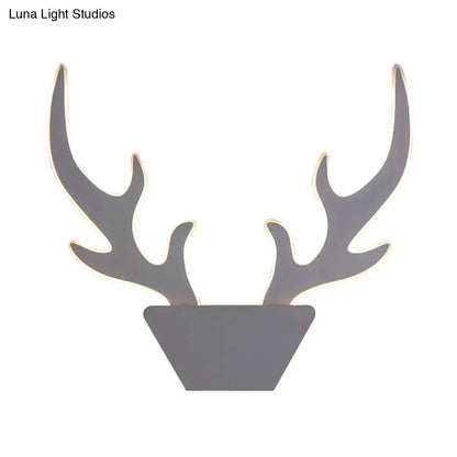 Gray metallic deer antler light fixture with art deco design in black and white for bedroom wall sconce use