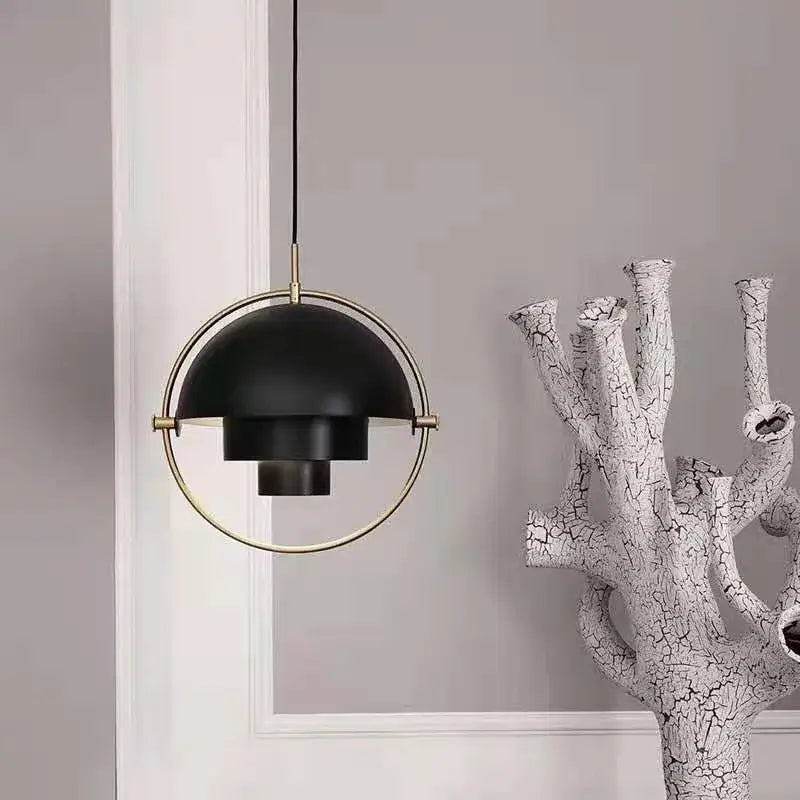 Black matte pendant light with circular brass frame and layered dome design art deco bulb base for dining room