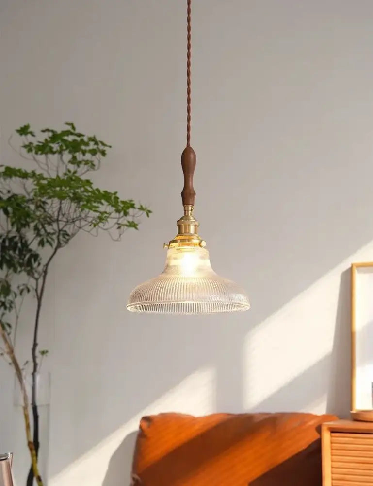 Art deco brass glass retro chandelier featuring a vintage clear ribbed glass shade with brass accents and dark wood cord