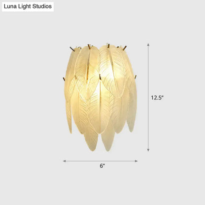 Art deco leaf sconce lamp with clear glass, brass leaf design, and golden frame for elegant dining room lighting