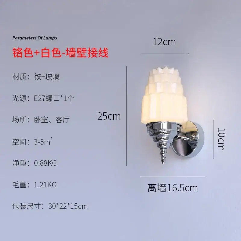 A sleek chrome wall lamp with decorbites cream glass tiered frosted shade ideal for bedroom lighting