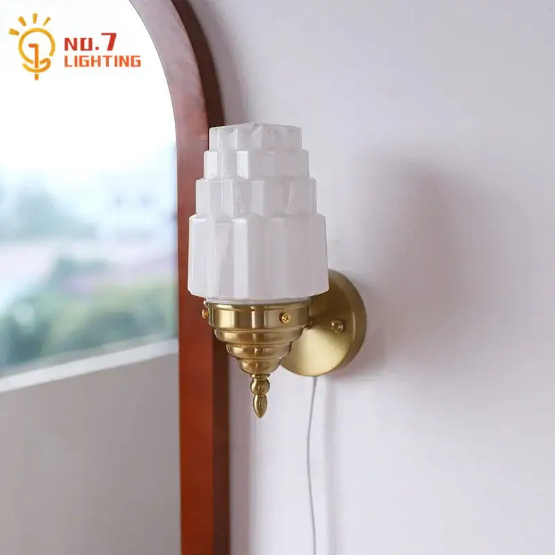 Art deco wall lamp with white tiered decorbites cream glass led shade and brass-finished ornate sconce for bedroom