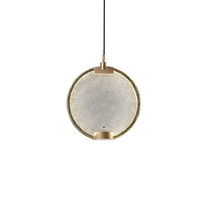 Art deco clear pink glass pendant light with a textured frosted shade framed by brushed brass accents by decorbites