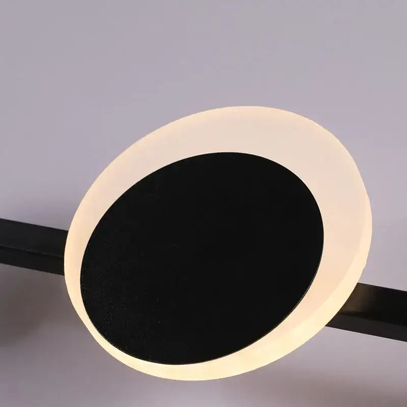 Art deco led wall sconce with a modern circular design featuring an orange gold finish and soft warm glow