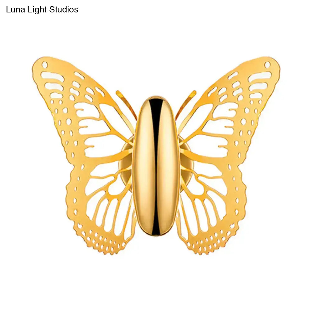 Gold butterfly wall sconce with intricate cut-out wings and polished metal finish for kids room decor