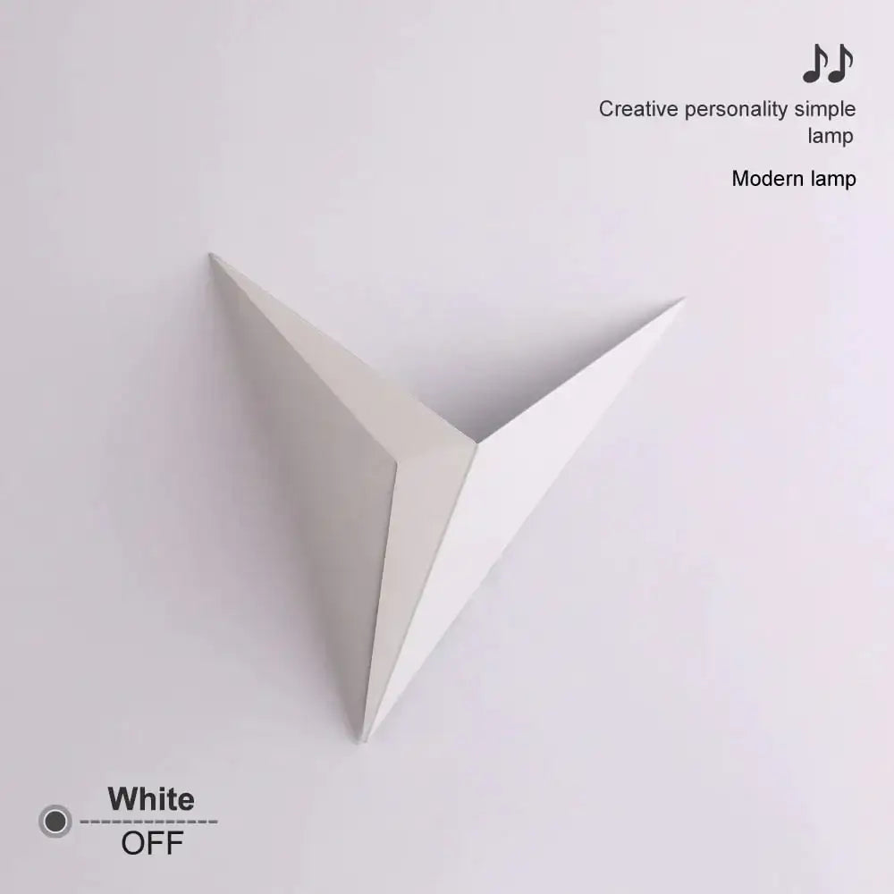A minimalist white geometric wall light with a diamond shape modern design ideal for bedroom decor