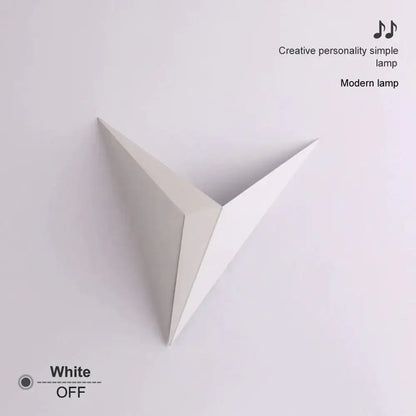 A minimalist white geometric wall light with a diamond shape modern design ideal for bedroom decor