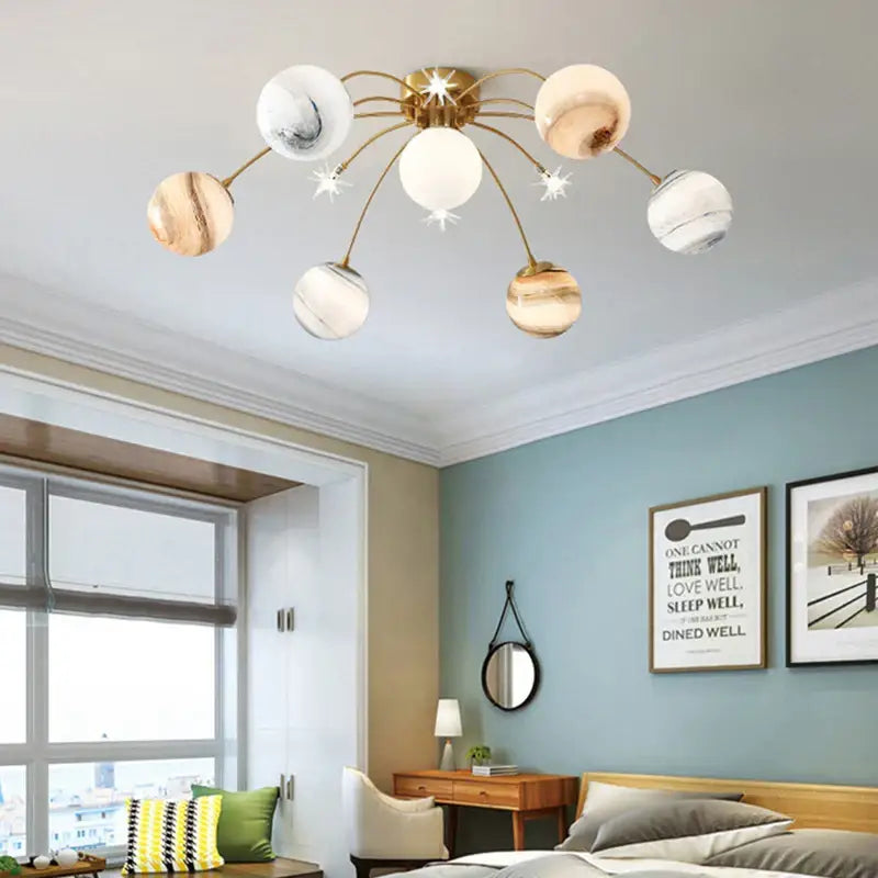Art deco gold planet ball pendant lamp with six globe shades in marble and wood grain finishes for dining room decorbites