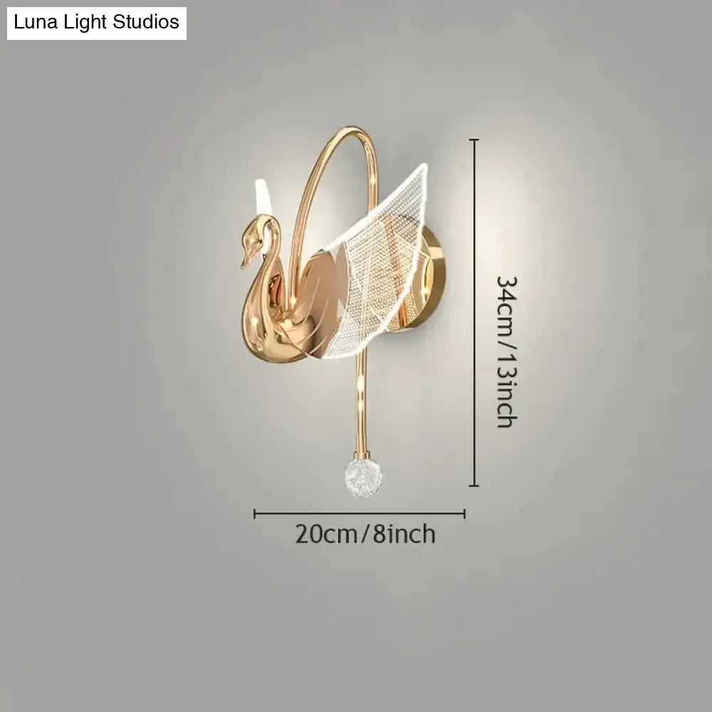 Art deco gold swan wall lamp with mesh wing and crystal accent for elegant bedroom bedside wall lighting