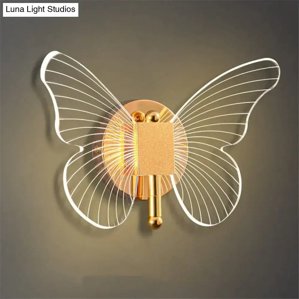Art deco gold-toned butterfly wall lamp with translucent white wire wings for bedroom bedside wall lighting