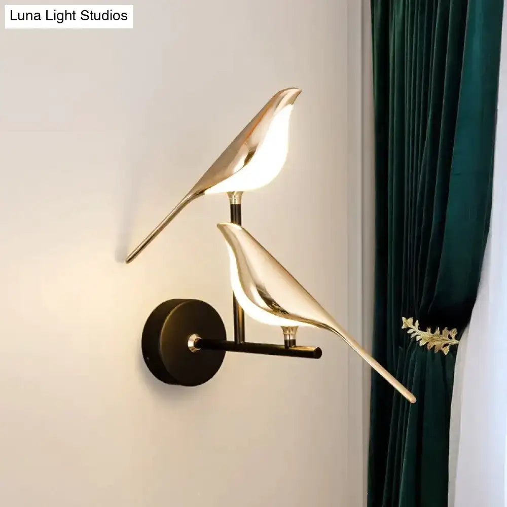 Art deco gold-toned swan wall lamp with crystal and warm light ideal for bedroom bedside wall use