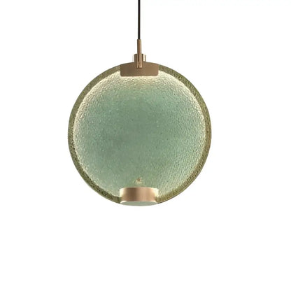 Art deco lavender glass horo led pendant light featuring a round textured green glass pendant light with brass accents