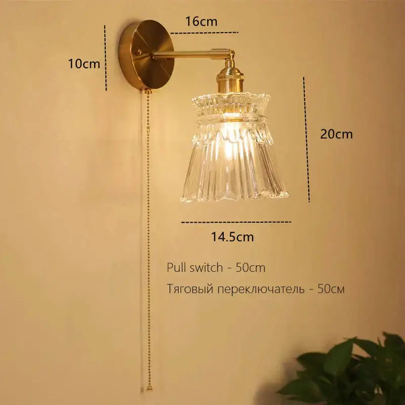 Antique brass-finished art deco led wall lamp with clear fluted glass shade and pull chain switch for bedroom decorbites sconce