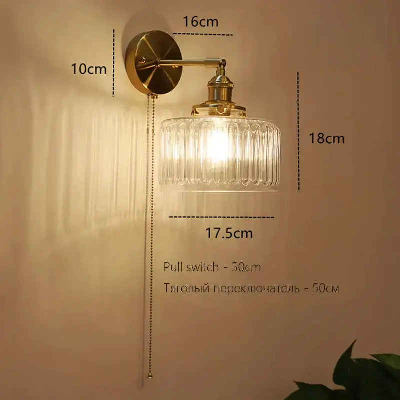 Vintage-style brass art deco led wall lamp with clear ribbed glass shade and pull chain switch by decorbites