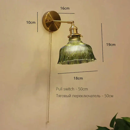 Vintage-style brass art deco led wall lamp with green ribbed glass shade and adjustable pull chain switch by decorbites