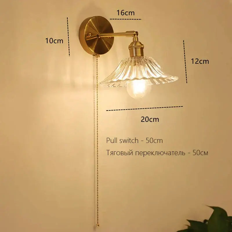 Vintage-style brass Art Deco led wall lamp with fluted glass shade and exposed bulb for decorbites art deco decor