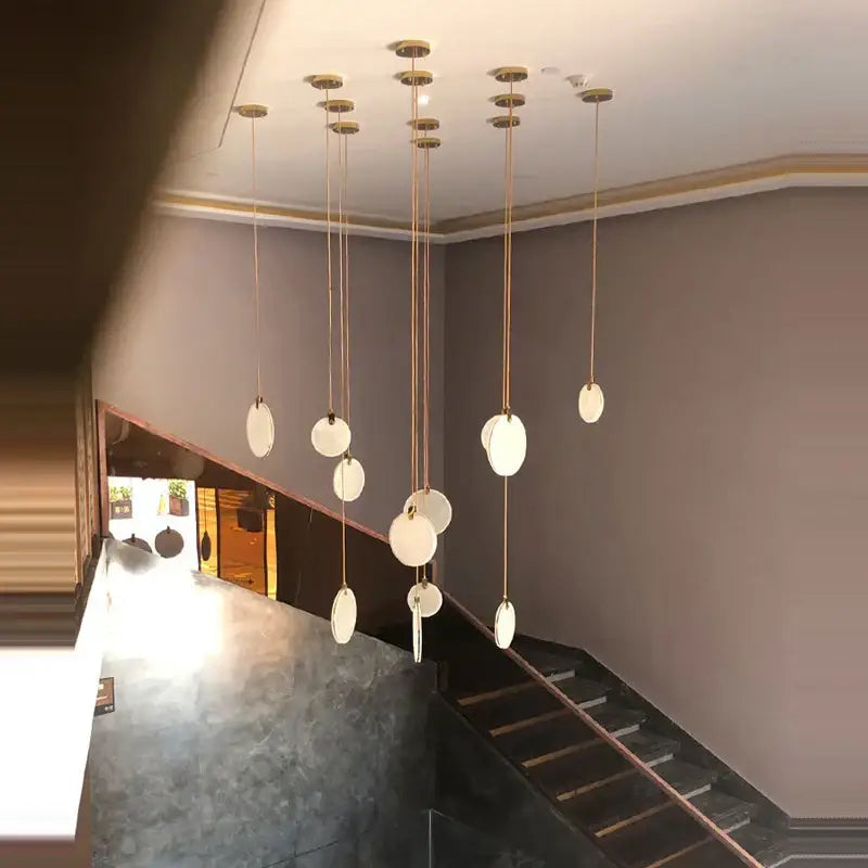 Art deco marble golden lustre pendant light with frosted glass shades and brass cords for dining room illumination