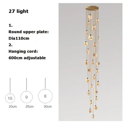 A modern art deco marble golden lustre pendant light with 27 warm oval glass pendants for dining room