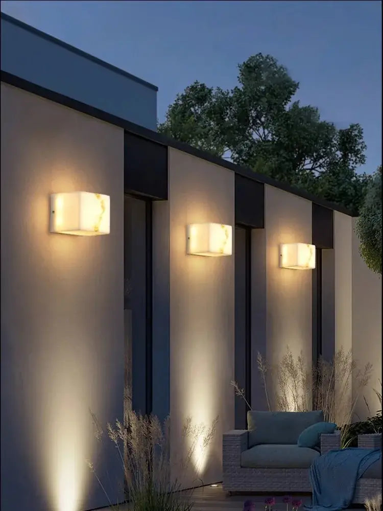 Modern art deco marble wall sconce with warm glowing alabaster-like light for living room decorbites collection