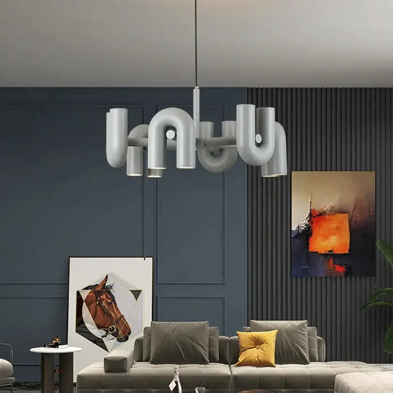 Modern silver pipe art deco metal chandelier with curved interconnected arms for black and orange dining room decorbites art deco