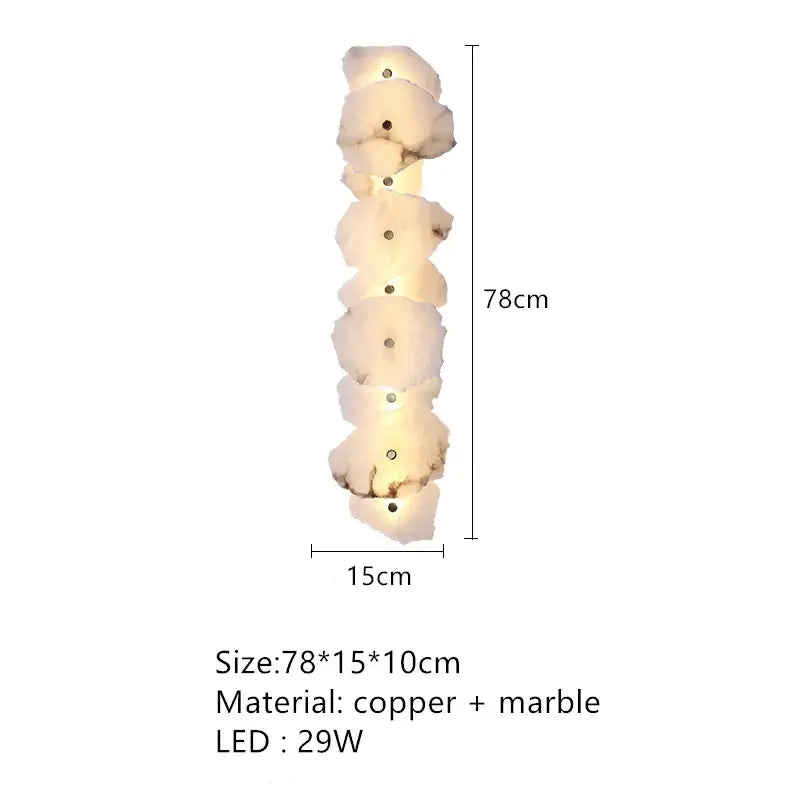 Art deco off white marble led wall sconce with layered organic shapes and copper accents for elegant marble lighting decorbites