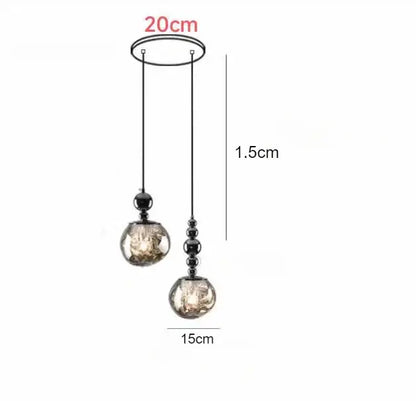 Modern black-framed art deco pendant light with two amber-toned glass globes for stylish living room lighting under square meters