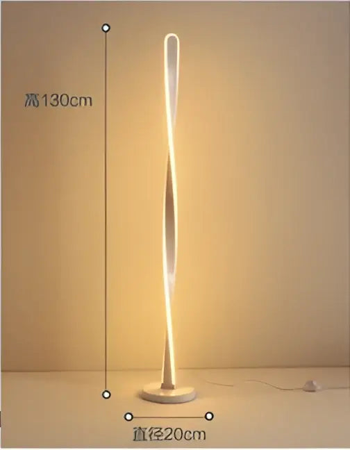 A sleek art deco floor lamp with a twisted glowing gold design and metallic base for living room decorbites ambient light