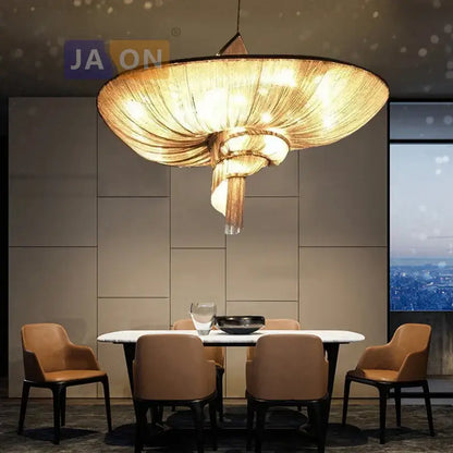 Golden intricately woven art deco vintage pendant lights with modern spiral design hanging above dining table decorbites