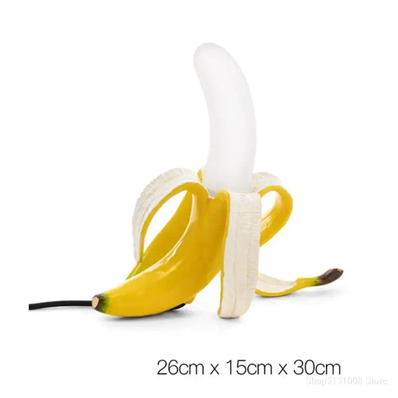 A glossy yellow and white banana-shaped usb flash drive with peeled peel design resembling decorbites glass lampshade led lighting fixture