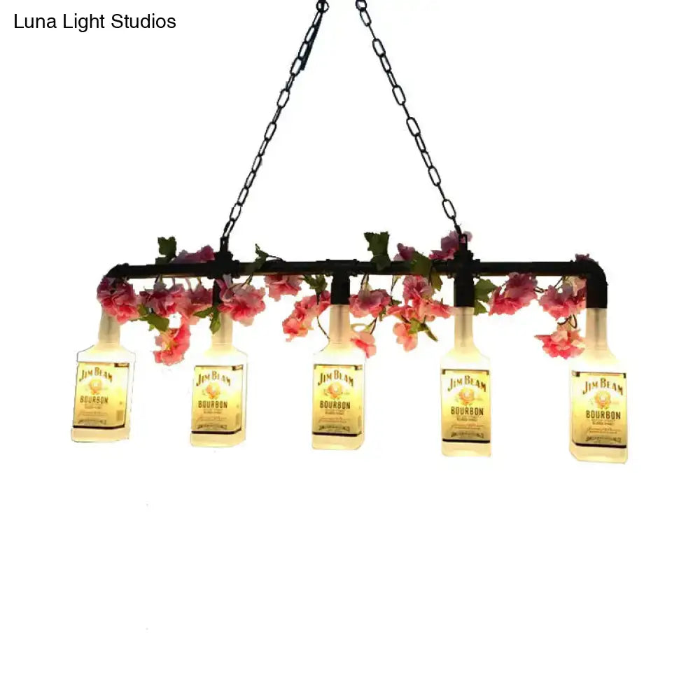 Black metal pendant light with five illuminated jim beam bourbon bottles and pink floral accents ideal for restaurants