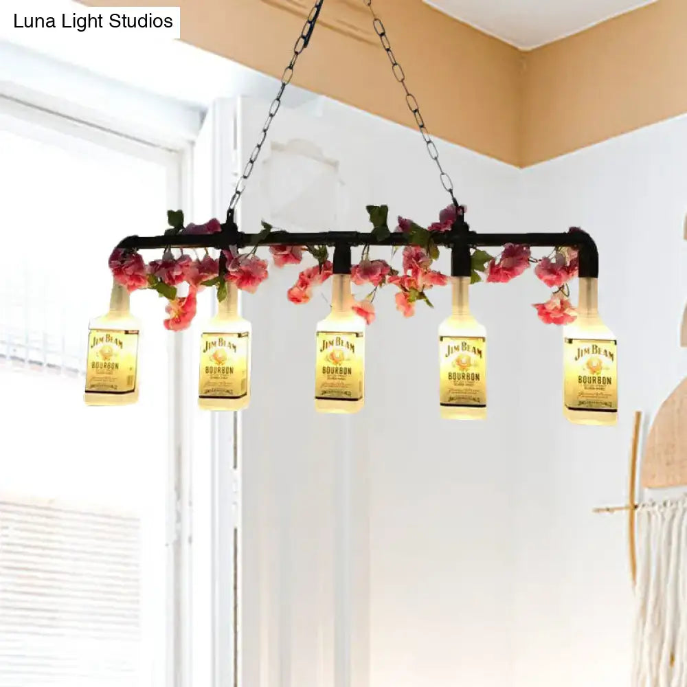 Black metal pendant light featuring five illuminated jim beam bourbon bottles with pink floral accents for restaurants and islands