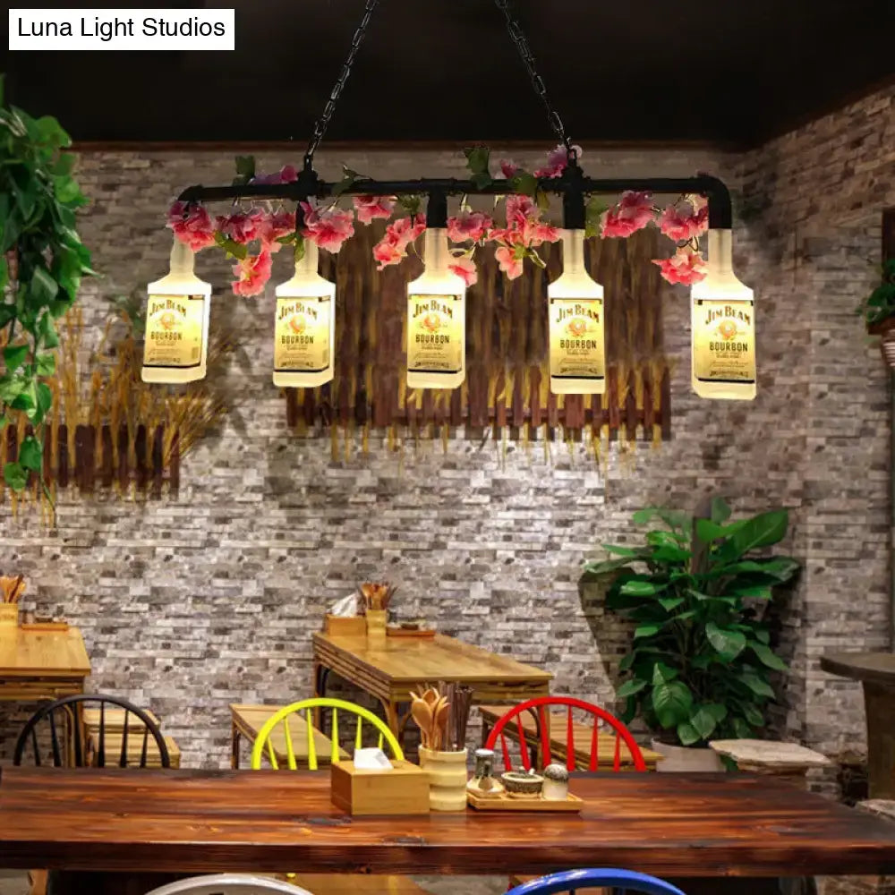 Decorbites vintage yellow bottle pendant light with five illuminated jim beam bourbon bottles and pink flowers on metal bar