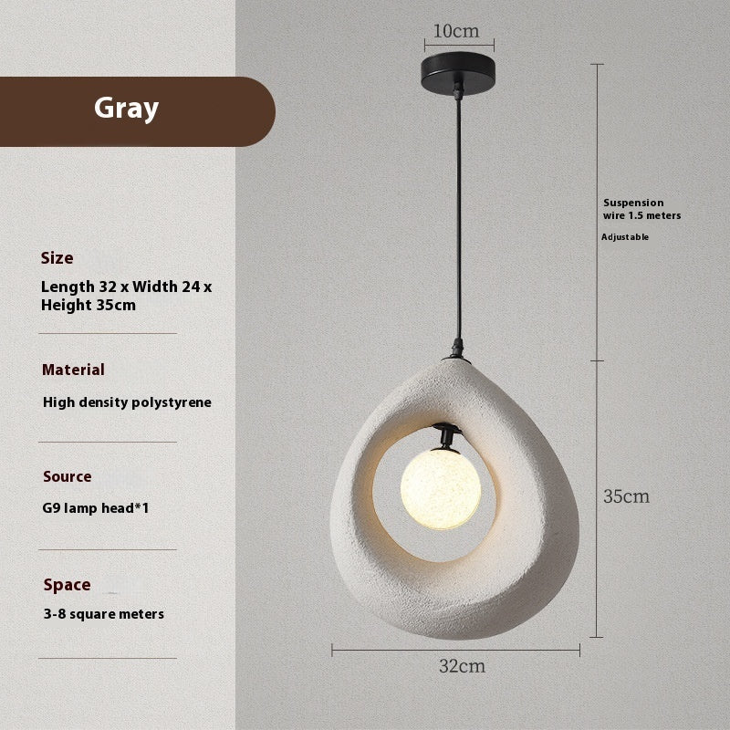 Gray polystyrene pendant light with a teardrop shape and black metal hardware.