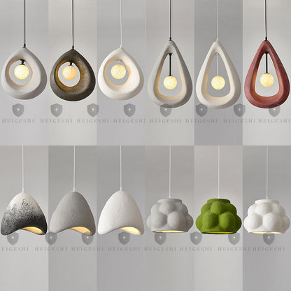 Modern teardrop-shaped pendant light with a concrete-like texture, available in various colors including gray, white, and green.