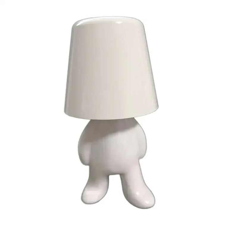 White ceramic articulated golden man table lamp with lampshade head and rounded body for bedroom night light use