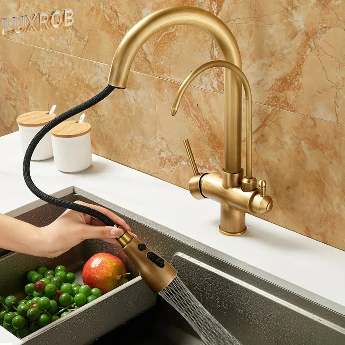 Brass-finished durable kitchen faucet with flexible black hose and pull-out spray head in antique bronze finish