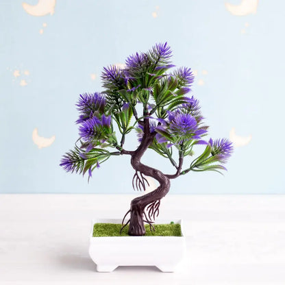 Artificial bonsai tree with vibrant purple flowers and green foliage in white pot with artificial moss garden decor