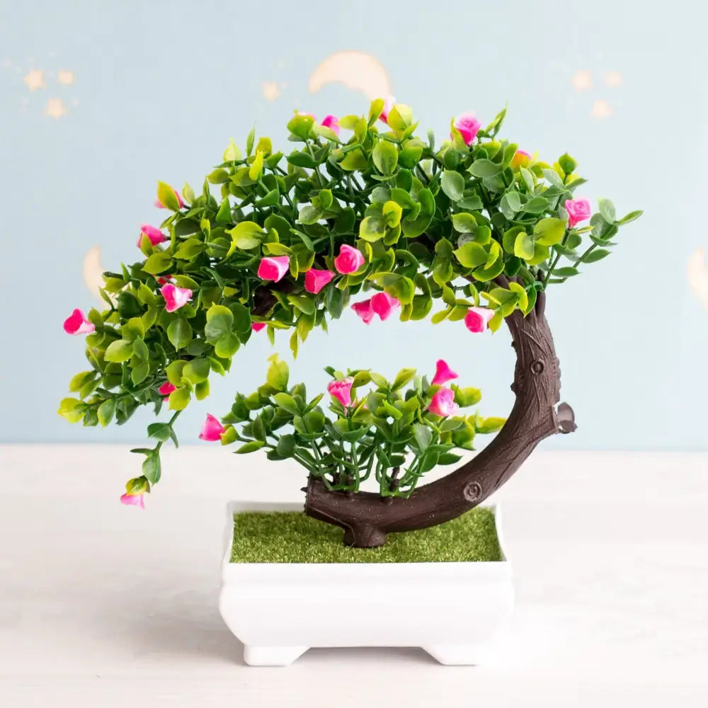 Artificial bonsai tree with vibrant green leaves and delicate pink blossoms crafted from durable materials for decor
