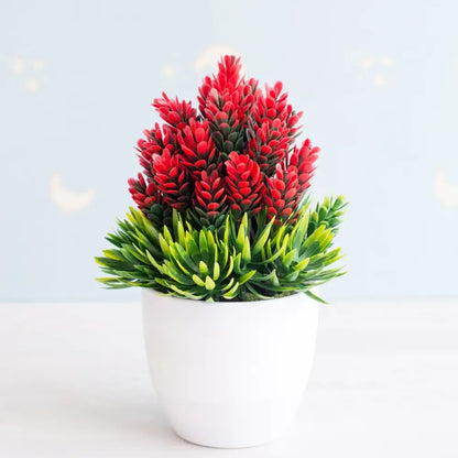 A vibrant artificial bonsai tree with red and green foliage in a sleek white ceramic pot for garden decor