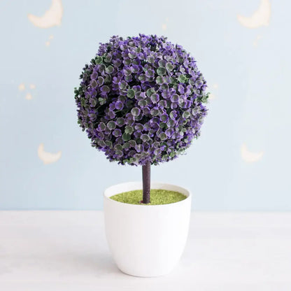 Artificial bonsai tree with dense purple and green foliage in a white ceramic pot for garden decor