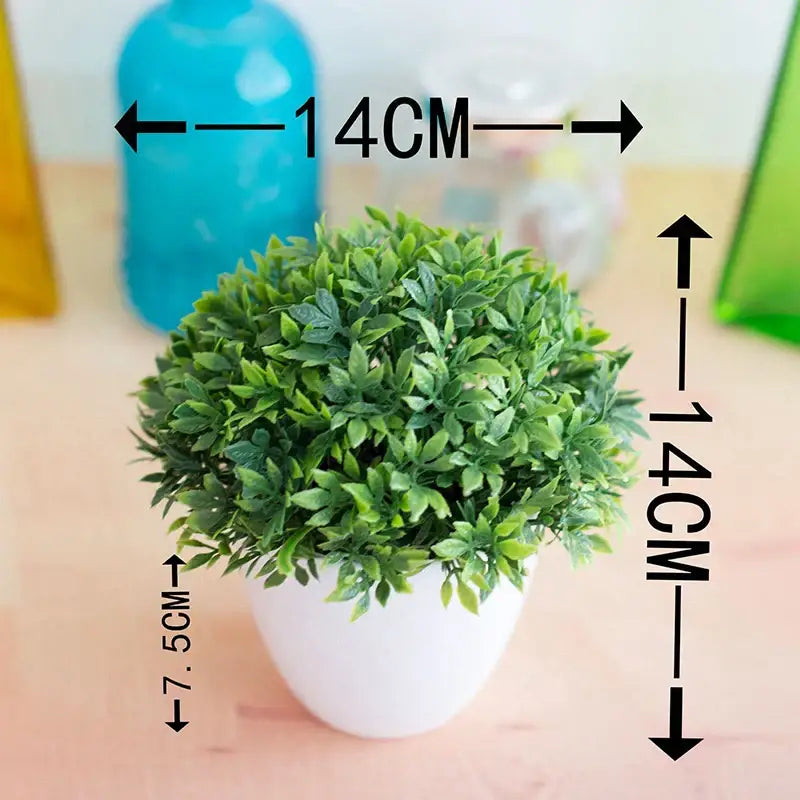 A compact round artificial bonsai tree with green and pink foliage in a white ceramic pot for garden decor