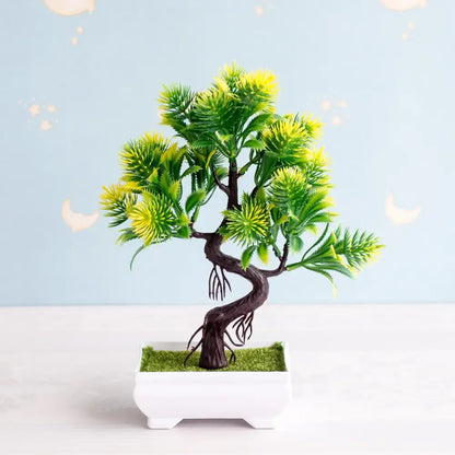 Artificial bonsai tree with dark twisted trunk and vibrant green yellow foliage in white pot with artificial moss