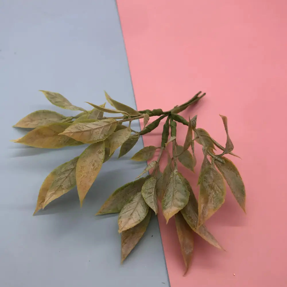 A delicate decorbites green plant flower cherry branch with muted green yellow synthetic foliage for living room decor