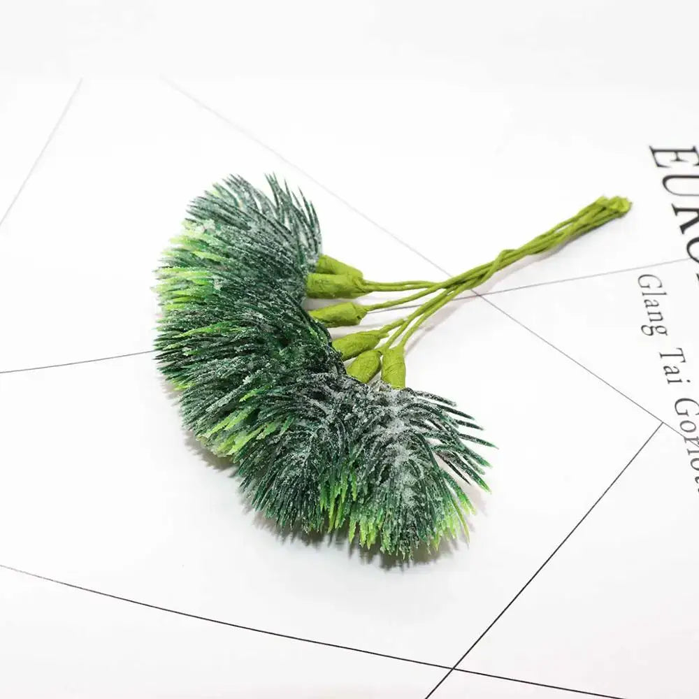 Frosted green artificial pine sprigs with feathery needles in a decorbites green plant flower cherry berry bundle for decor