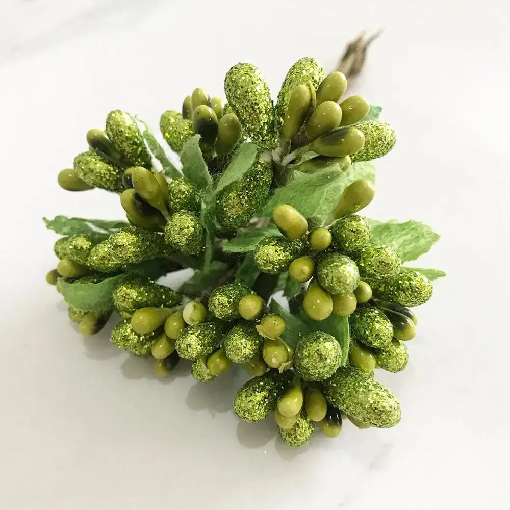 A cluster of artificial green plant flower cherry berries with glittery surfaces and small leaves for decorbites green plant decor