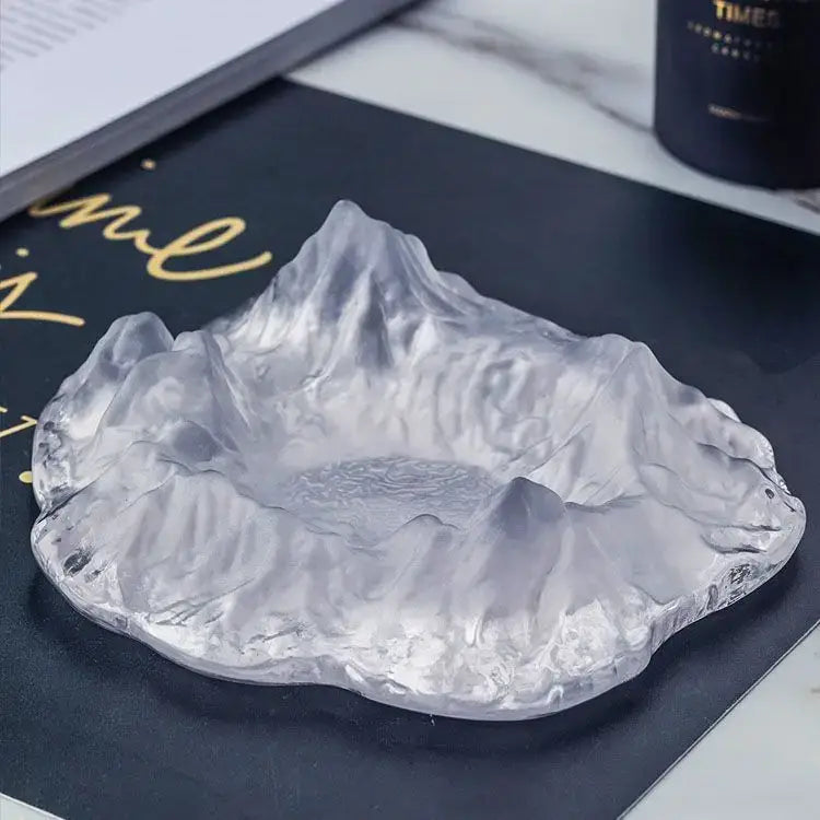 Artistic clear and gold decorbites iceberg glass dessert plate shaped like a mountain range with textured peaks and valleys