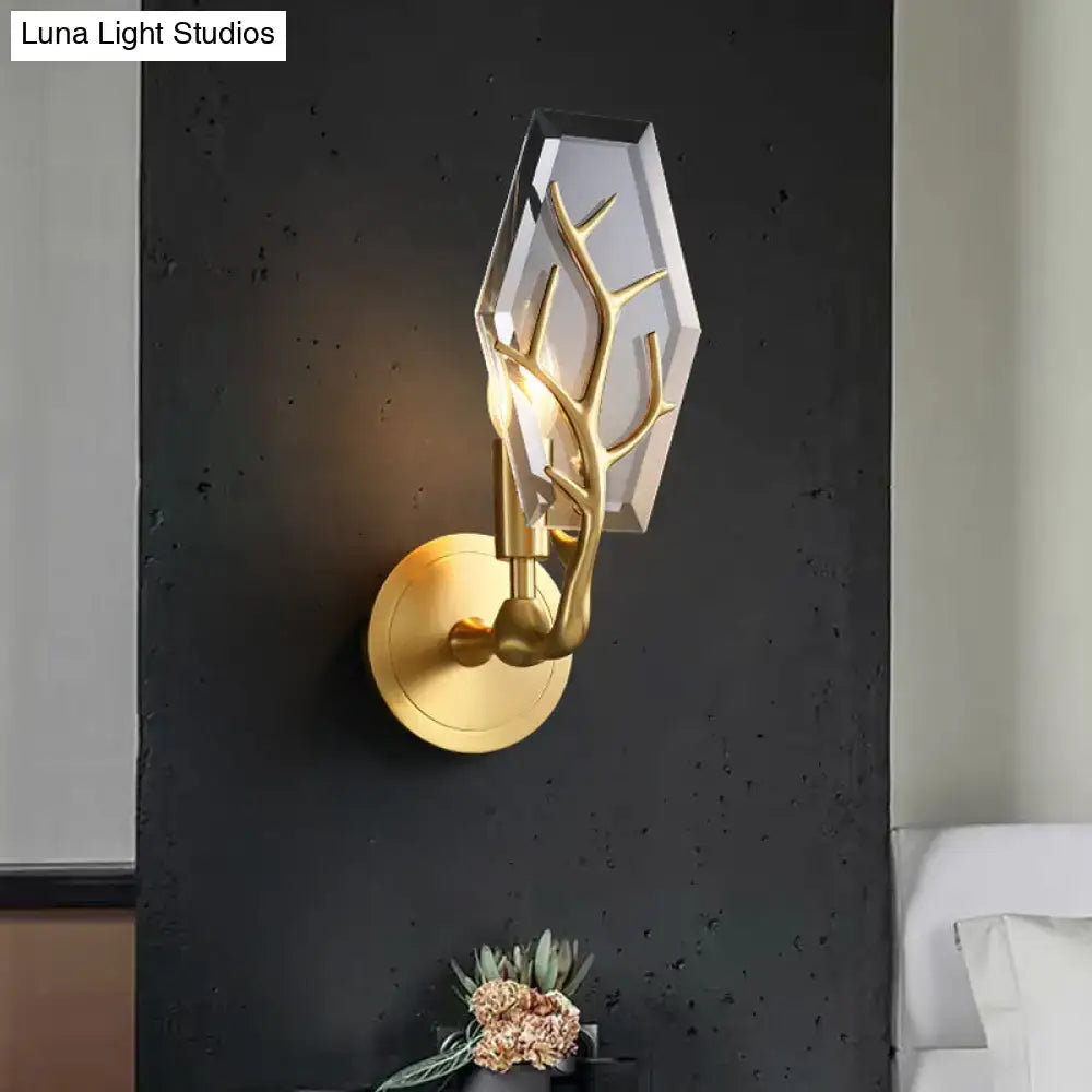 Gold-toned wall lamp with sculptural antler design and faceted crystal shade, a great addition for living room lighting